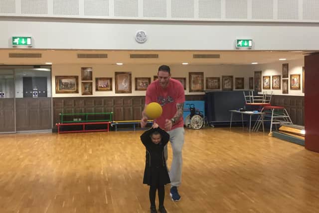 Paul showed the children basketball tricks.