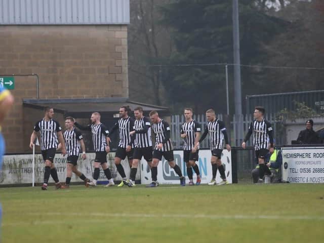 The Corby Town players celebrate one of their goals during the 3-2 success over Berkhamsted at Steel Park. Picture by Alison Bagley