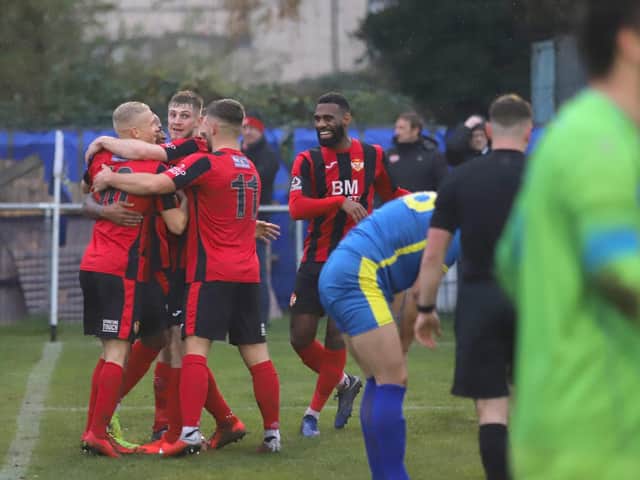 Kettering Town celebrate Lindon Meikle's goal which gave them the lead in their 3-0 FA Trophy success at Peterborough Sports. Pictures by Peter Short