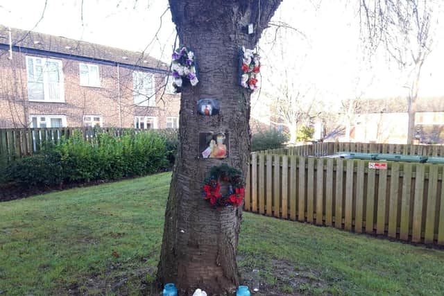 A tribute remains at the scene in Nest Farm Crescent.
