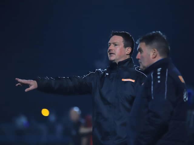 Paul Cox and assistant-manager John Ramshaw watch on from the sidelines during Kettering Town's 0-0 draw at Curzon Ashton last night. Pictures by Peter Short