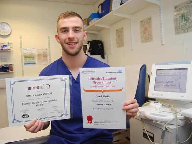 Cardiac Scientist Gareth Mackin with the two certificates from his examinations