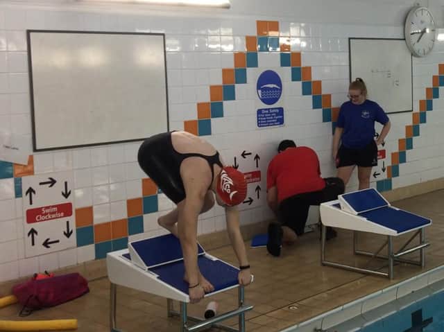 Emily Batchelor (12) preparing to dive from the new starting block