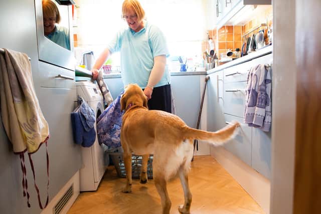 Luna helps Allison with the washing