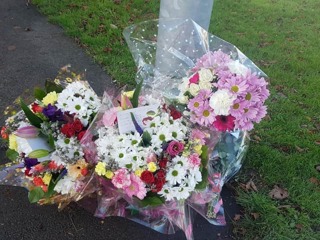People have begun leaving tributes to the victim in Wellingborough Road