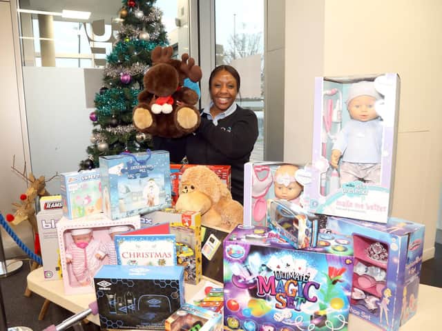 Corby Cube receptionist Debbie Harvey with some of the gifts donated to the appeal