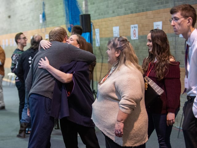 Clare Pavitt and Chris Nelson embrace as the morning draws to an end