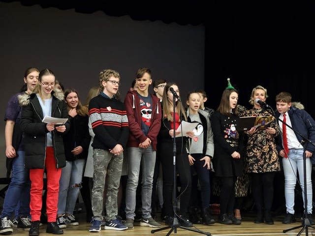 GCSE students perform their carol