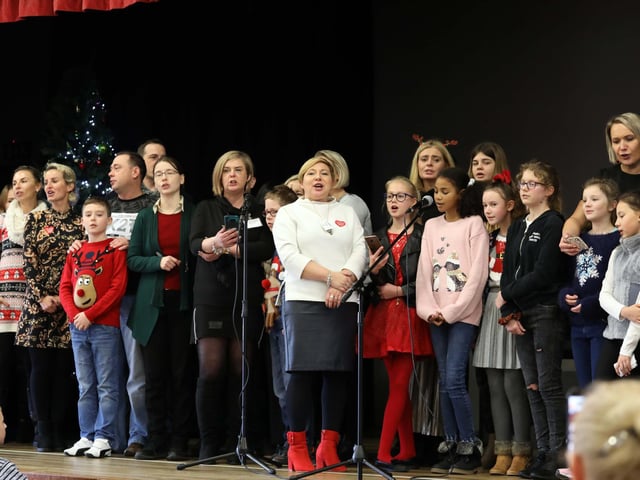 Students and staff on stage