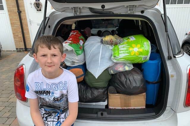 Thomas with his donations for Corby Rise