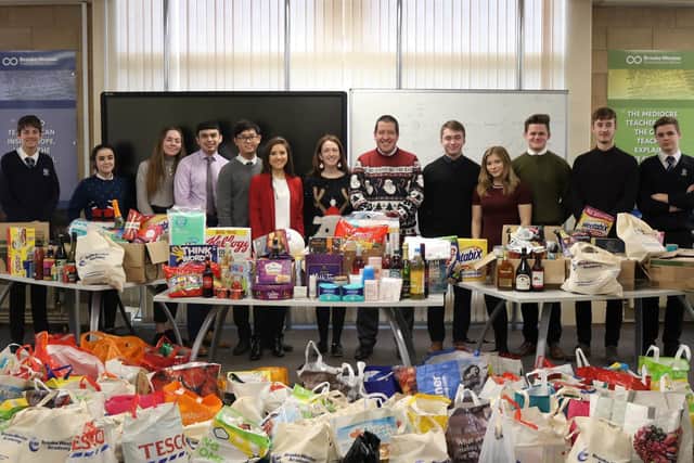 Principal Pete Kirkbride and teacher Selina Moore with the donations