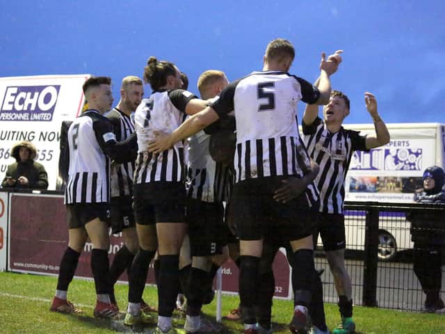 The Corby Town players celebrate Elliot Sandy's goal which earned them a 1-0 success over Welwyn Garden City at Steel Park. Pictures by Alison Bagley