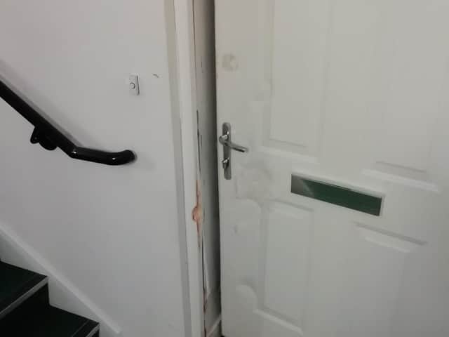 The police shared this photo of the door they rammed at an address in Rothwell on Saturday