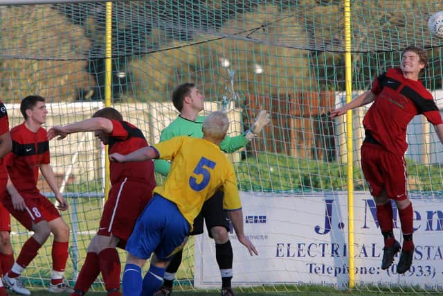 October 15 2011: Simon Underwood (number 5) heads one home for Wellingborough Town FC