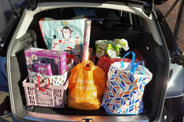 Cat and her husband Alisdair collect donations from in and around Corby
