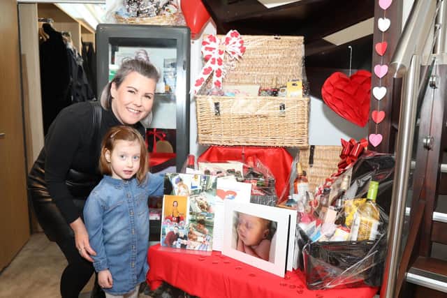 Stacy and Polly with the fundraising raffle
