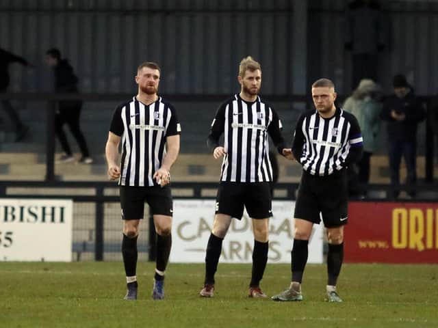 Joint-manager Gary Mulligan (centre), pictured with Joe Burgess (left) and captain Jake Duffy, knows only a win will do when Corby Town take on fellow high-flyers Halesowen Town at Steel Park this weekend