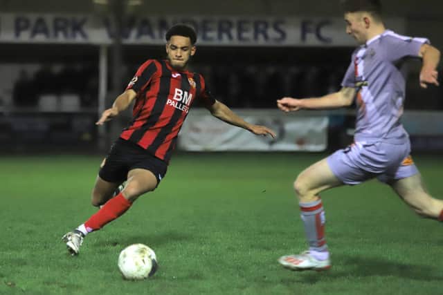 Jay Williams goes in to challenge an Altrincham opponent