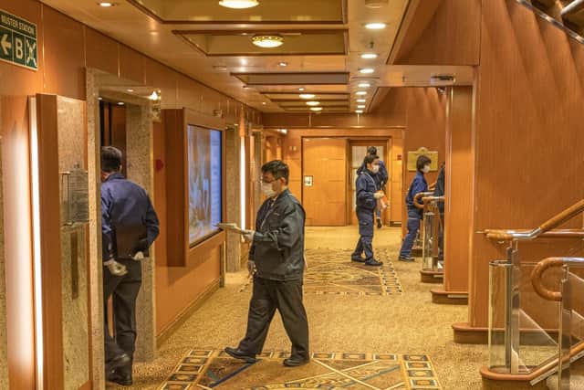Copyright David Abel. Japanese Health Officials reportedly visited every cabin on the ship.