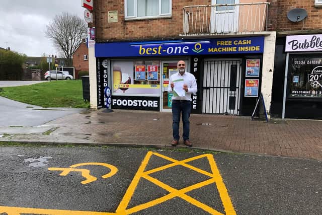 The offending disabled spot right outside Harry's shop