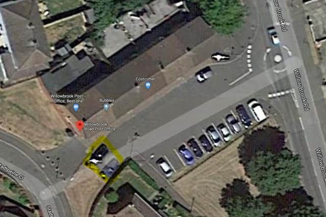 The two 'disabled' parking spaces are highlighted in yellow here