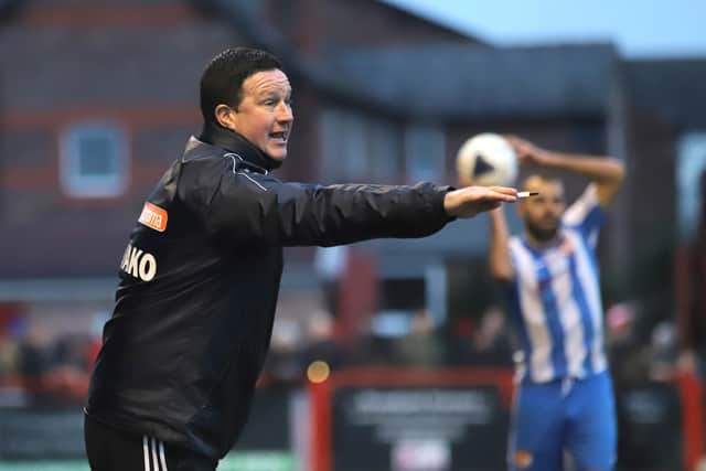 Paul Cox gives out some instructions from the sidelines at Moss Lane