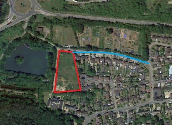 The land bounded in red is the development site. Larratt Road is highlighted in blue.