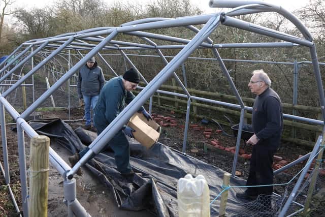 Andy, Lee and Rob tidy the broken polytunnel
