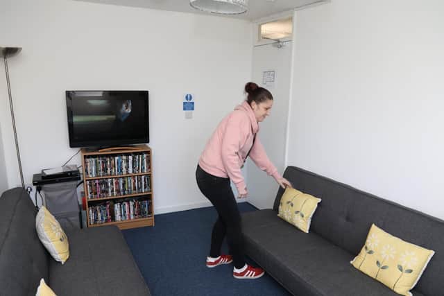 The living room is kept tidy with help from the volunteers