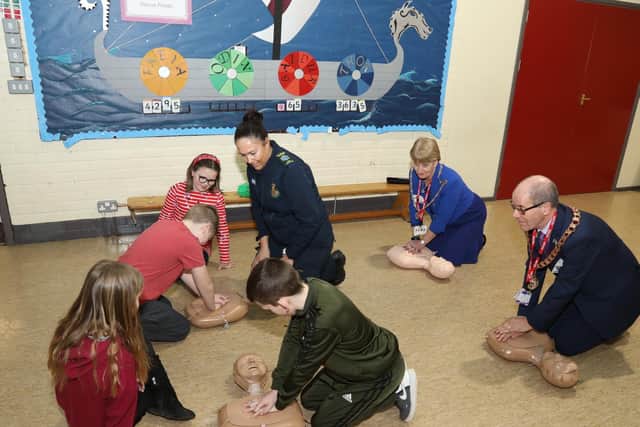 Mayor of Corby Ray Beeby and wife Toni join in the CPR session led by First Responder Sonia James