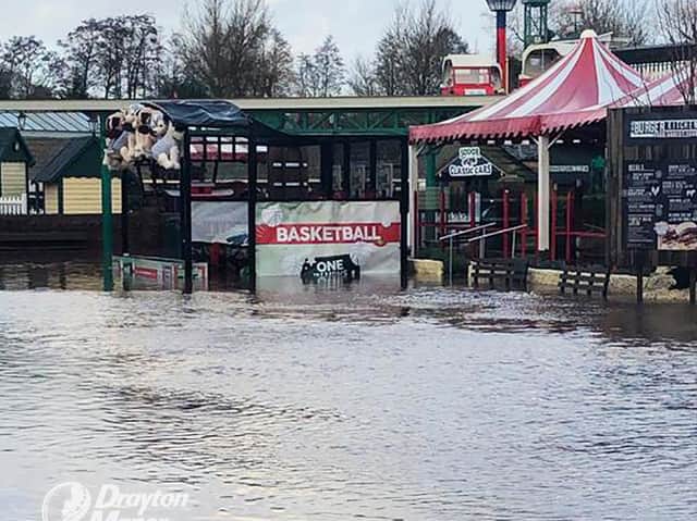 Drayton Manor Park has been left under water after the lake burst its banks