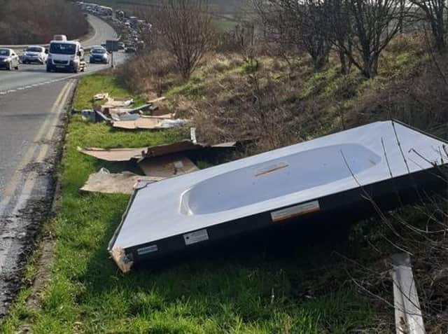 A hot tub lid blew on to the A14 this morning