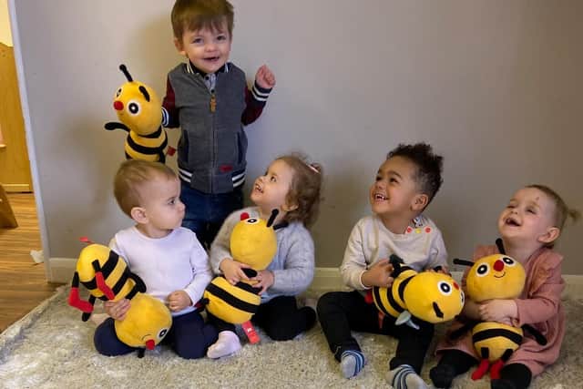 Youngsters from Busy Bees nursery in Corby celebrating the outstanding Ofsted report