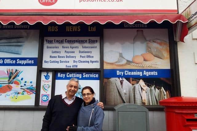 Nitin and his wife Darshana outside their shop.