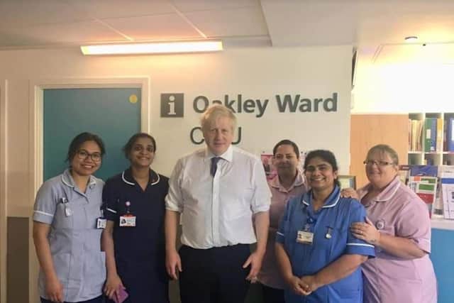 Boris Johnson with staff members on Oakley Ward. Picture: Teresa Brown