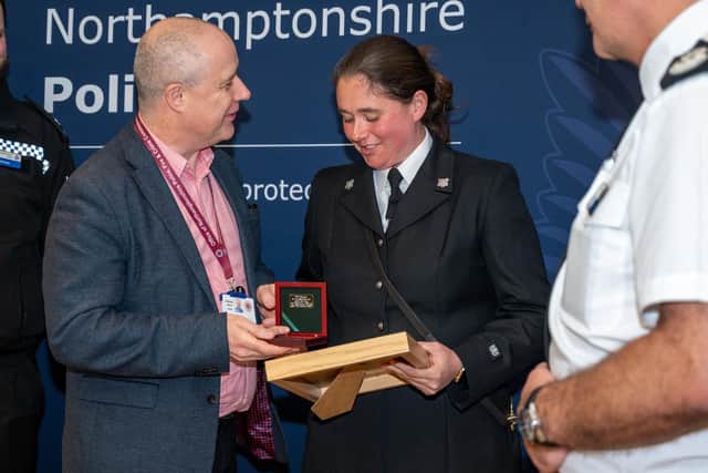 PC Lucy Sculthorpe accepts PD Harper's K9 Memorial medal from Northamptonshire police, fire and crime commissioner Stephen Mold. Photo: Northamptonshire Police