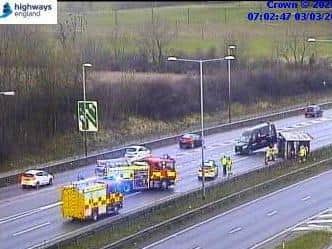Emergency services attempt to recover the vehicle at junction nine