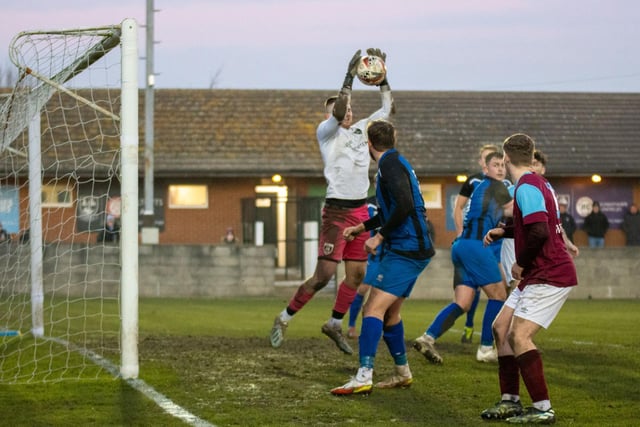 Maltby Main goalkeeper Owen Evans makes a good catch as the ball is played into the box by Emley. Picture: Mark Parsons