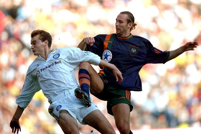 David Wetherall tries to avoid the boot of Newcastle United's Darren Peacock.