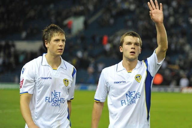 Jonny Howson waves as he walks off the pitch with Leigh Bromby at full time.