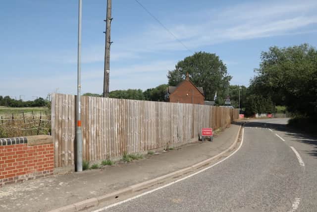 The fence runs alongside Irthlingborough Road
