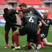 The Cobblers players were able to celebrate during the first half as Callum Morton gave them a 2-0 lead against Exeter City at Wembley