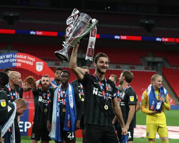 Charlie Goode was all smiles after steering Cobblers to Wembley glory