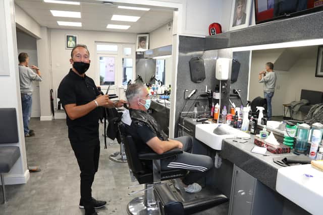 Vince Geriano with Neil Tilley in the chair