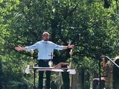 Rev Paul Frost leads the 'car park Communion'