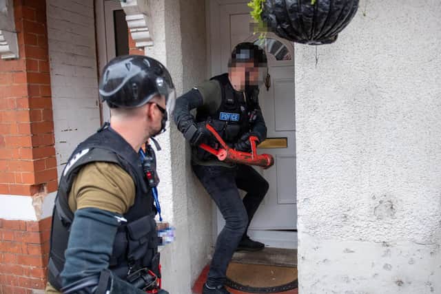 Police going into the property in Gordon Road, Wellingborough, today (Wednesday)