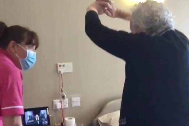 June at Duke's Court Care Home takes part in the pre-singing exercises