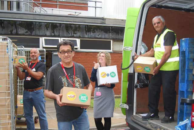 KGH We Care volunteers Terry Gidney and John Turton unload some of the final donations with We Care Team Leader, Jayne Chambers, and Yodel driver, Mohinder Pahl