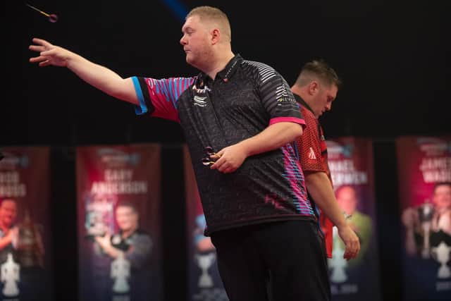 Ketterings Rapid Ricky Evans in action against Daryl Gurney in the first round of the World Matchplay on Monday night. Picture courtesy of Lawrence Lustig/PDC