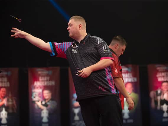 Ketterings Rapid Ricky Evans in action against Daryl Gurney in the first round of the World Matchplay on Monday night. Picture courtesy of Lawrence Lustig/PDC